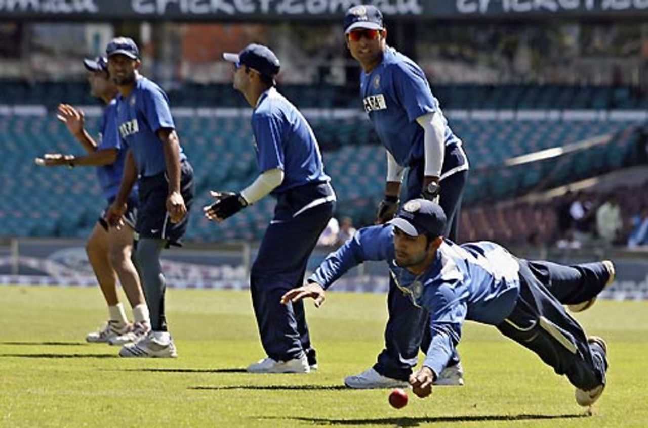 Dinesh Karthik makes a diving save during a fielding session, Sydney, January 1, 2008
