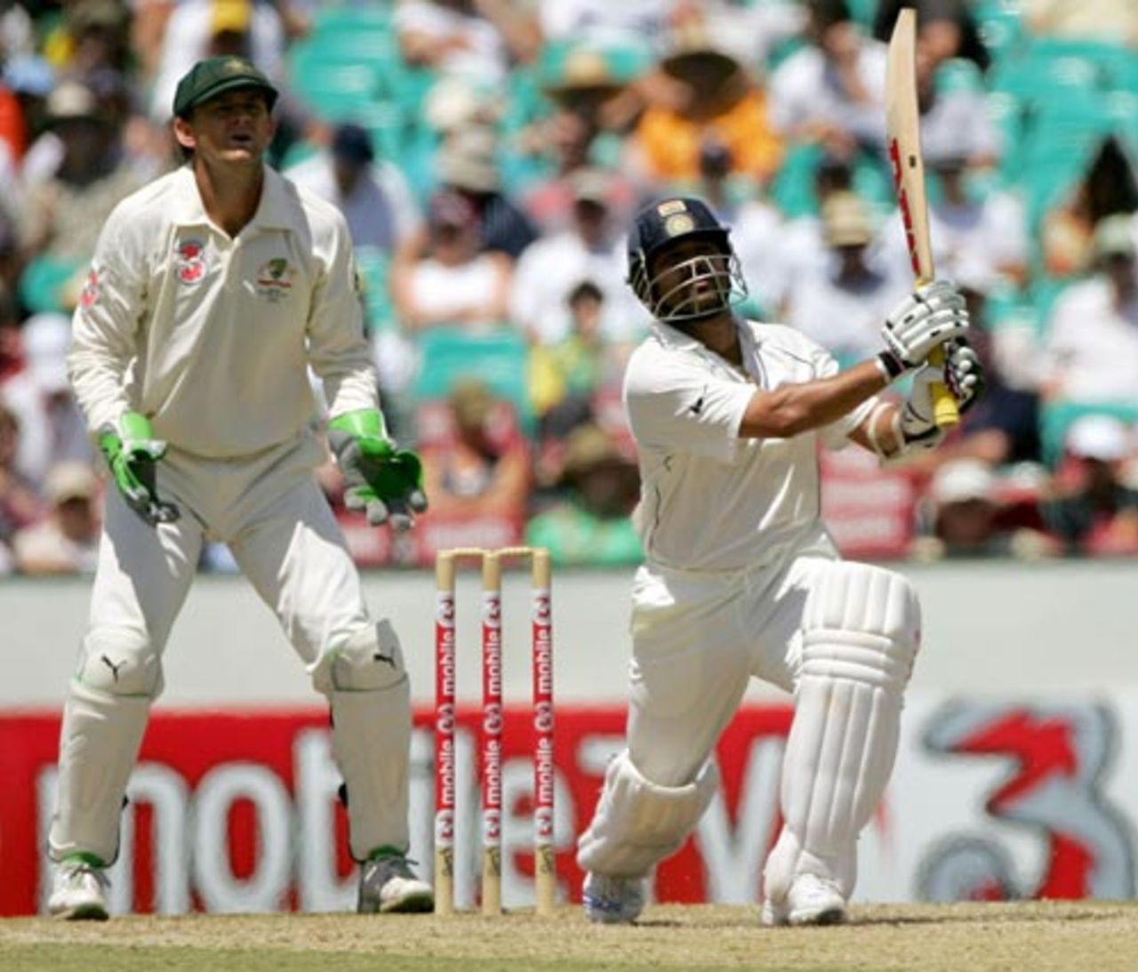 Adam Gilchrist looks on as Sachin Tendulkar hammers the ball, Australia v India, 2nd Test, Sydney, 3rd day, January 4, 2008