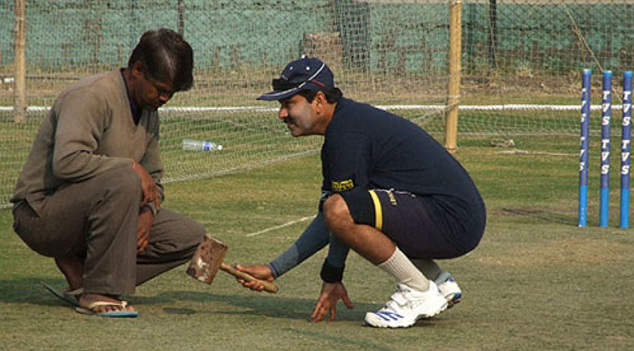 Delhi's bowling coach Manoj Prabhakar scrutinises the pitch, Indore, January 4, 2008