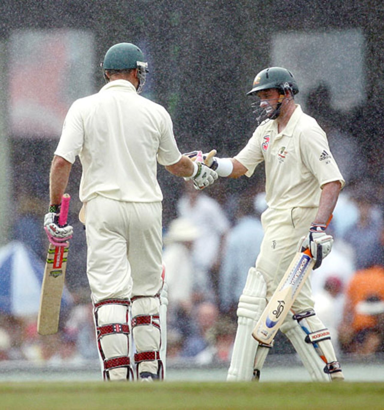 Michael Hussey shakes hands with Matthew Hayden in the rain, Australia v India, 2nd Test, Sydney, 4th day, January 5, 2008
