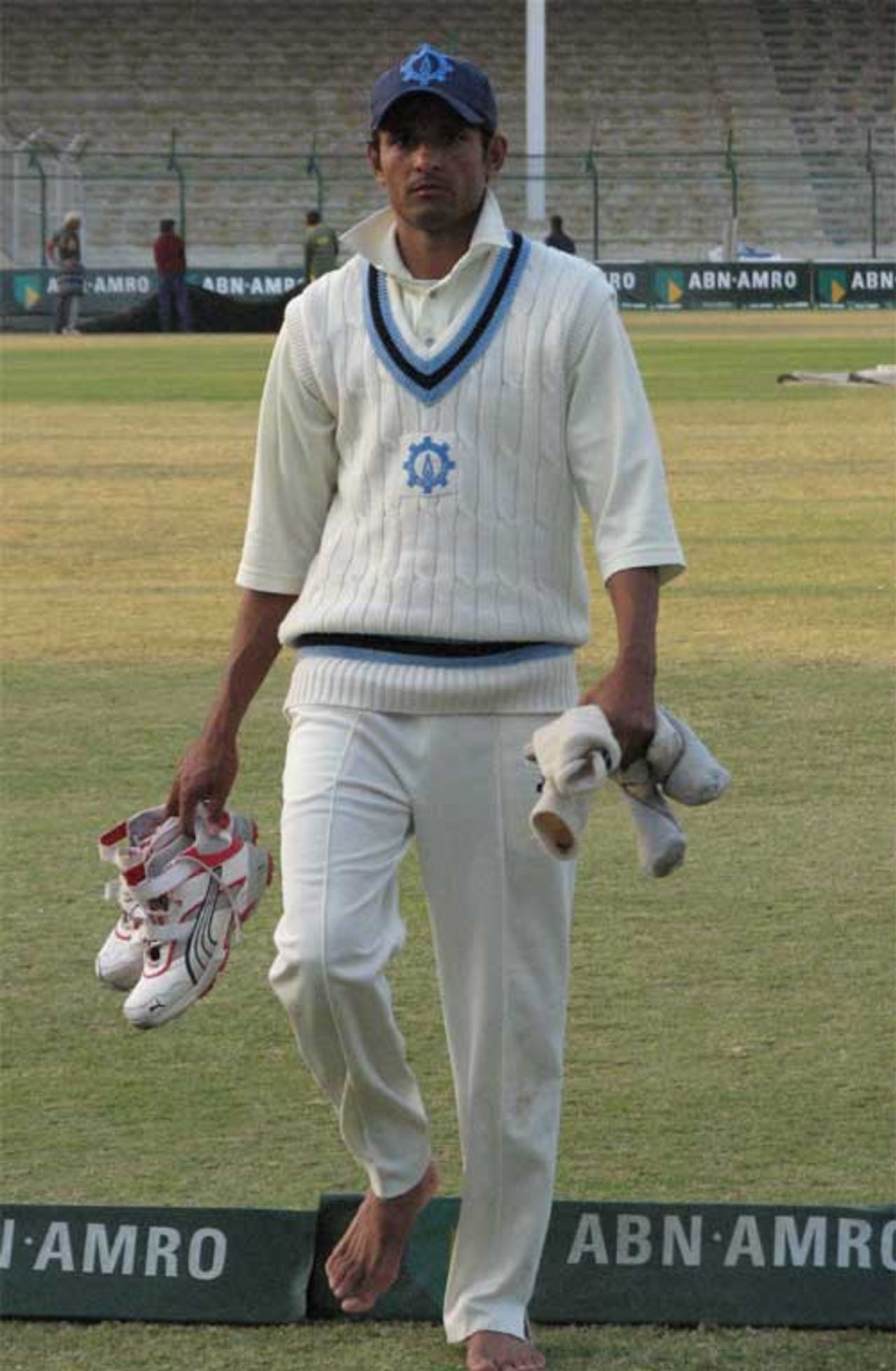Asad Ali walks off the field after taking three wickets, HBL v SNGPL, Quaid-e-Azam Trophy final, Karachi, 3rd day, January 9, 2008