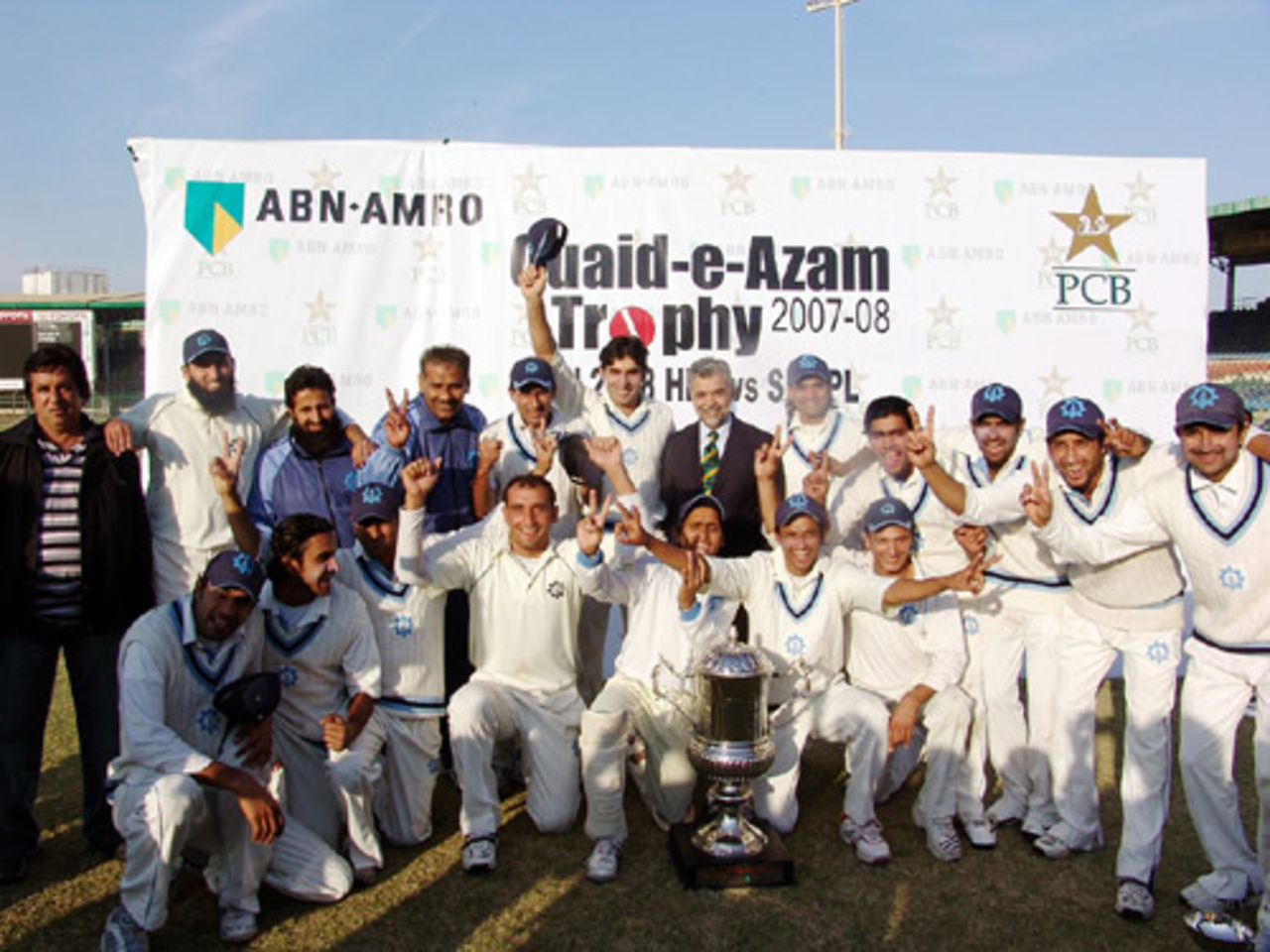 The Sui Northern Gas Pipelines Limited team pose with the Quaid-e-Azam Trophy , HBL v SNGPL, Quaid-e-Azam Trophy final, Karachi, 5th day, January 11, 2008 