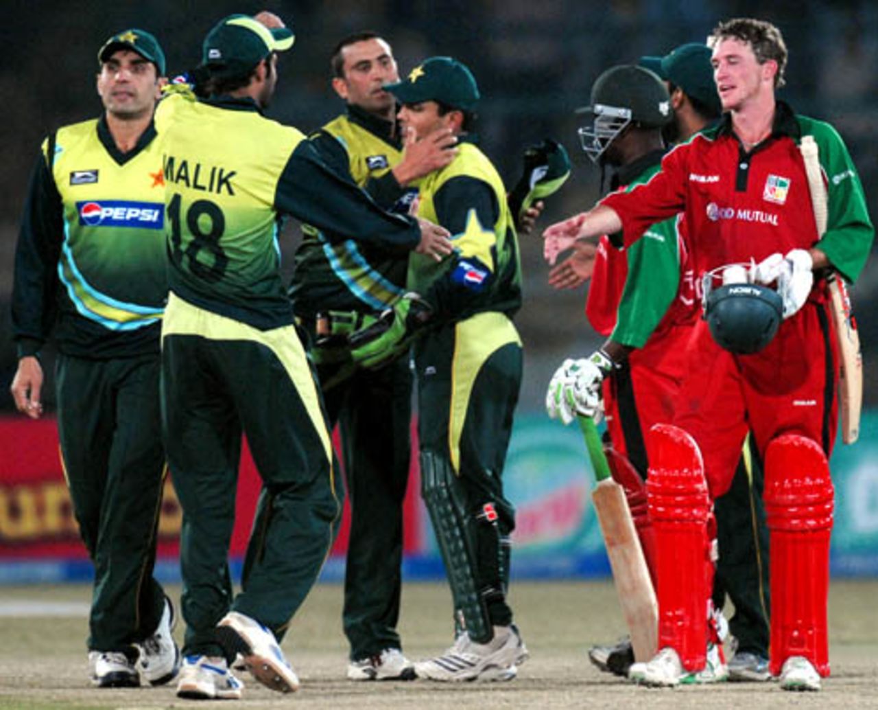 Sean Williams congratulates Shoaib Malik on Pakistan's win, Pakistan v Zimbabwe, 1st ODI, Karachi, January 21, 2008