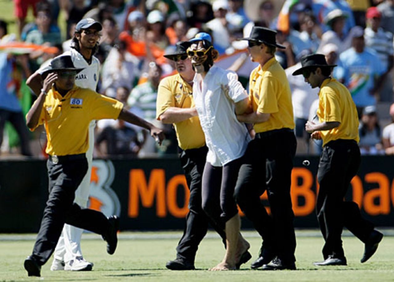 Security officials escort a pitch invader off the field, Australia v India, 4th Test, Adelaide, 4th day, January 27, 2008