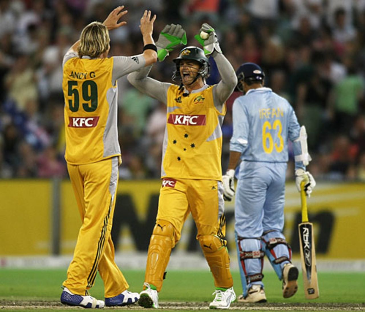 Adam Gilchrist congratulates Nathan Bracken on getting Irfan Pathan's wicket, Australia v India, Twenty20 international, Melbourne, February 1, 2008