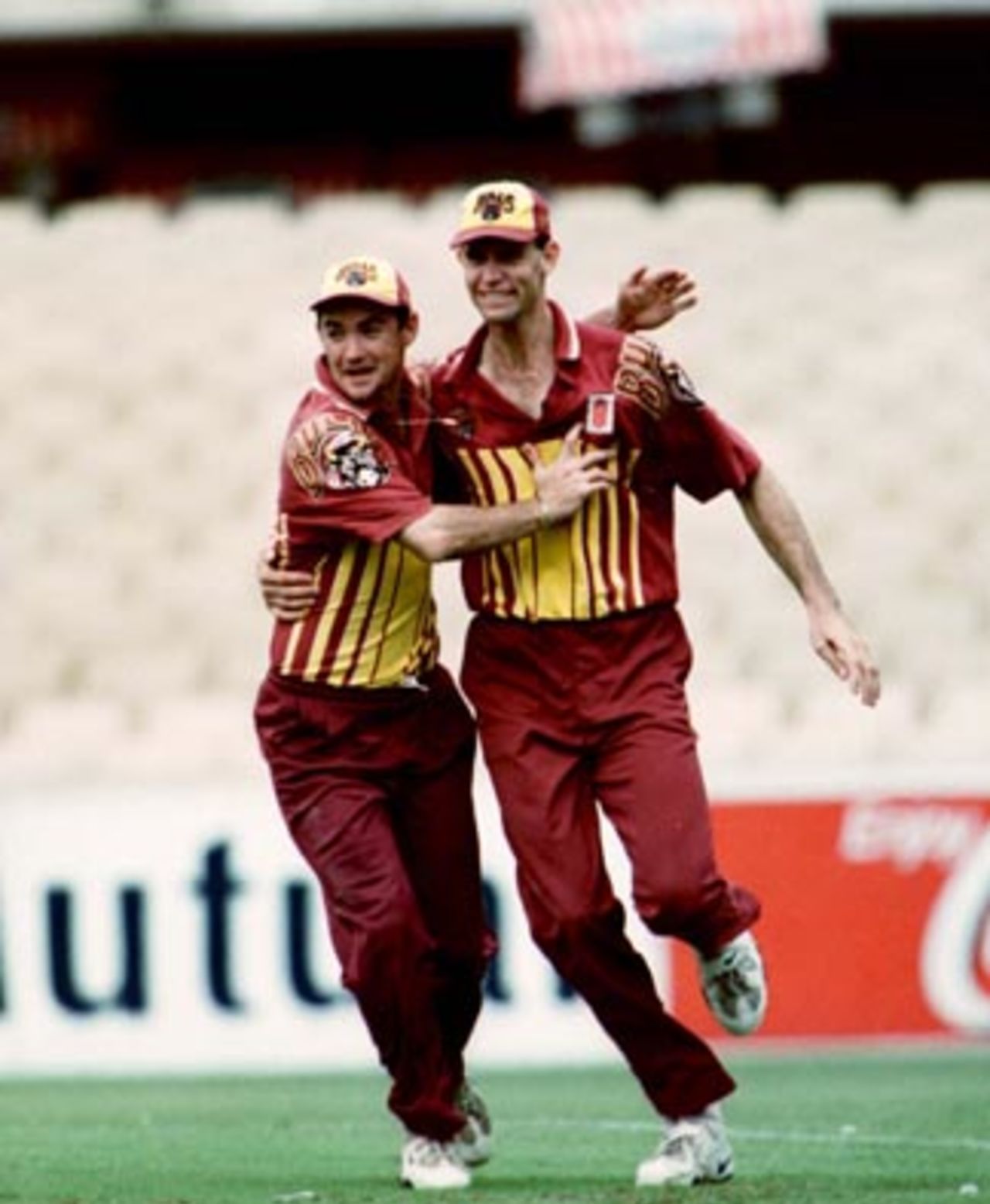 Jimmy Maher congratulates Greg Rowell after Rowell caught Richard Chee Quee during the Mercantile Mutual Cup Final at the Sydney Cricket Ground, March 1st 1998.