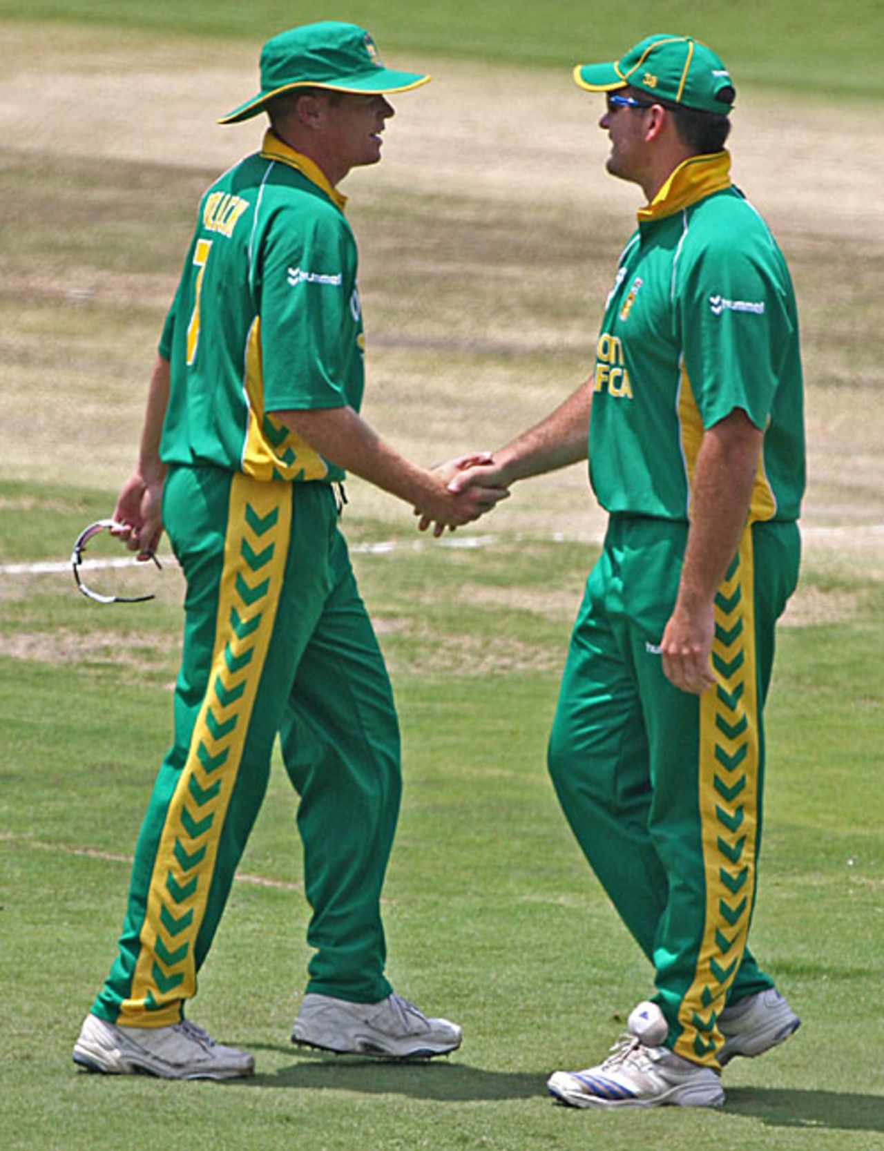 Graeme Smith shakes hands with Shaun Pollock after sending down his last ball in international cricket, South Africa v West Indies, 5th ODI, Johannesburg, February 3, 2008