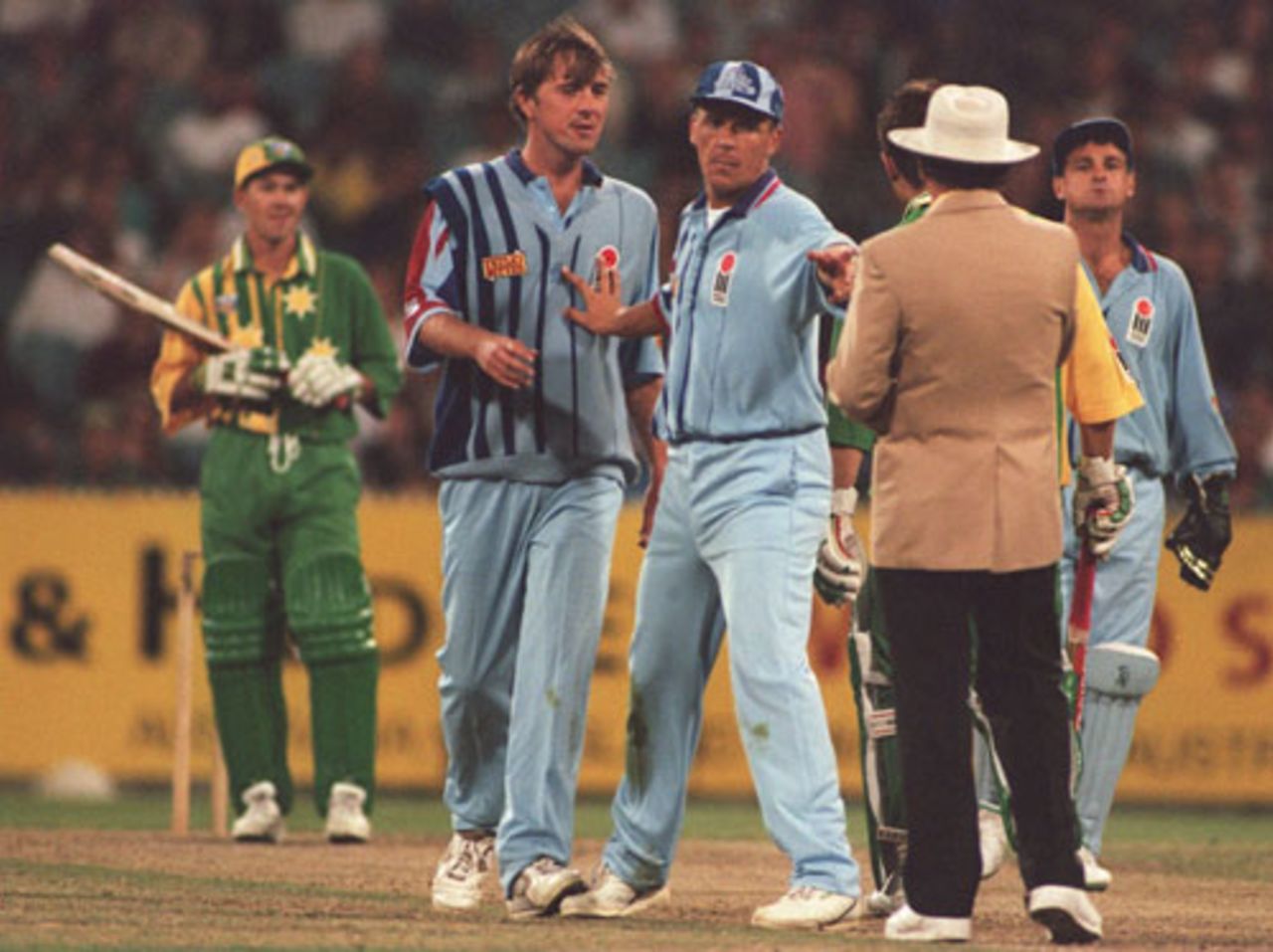 Alec Stewart steps in to prevent any argument between Phil Tufnell and umpire Tony McQuillan, Australia v England, MCG, December 13, 1994