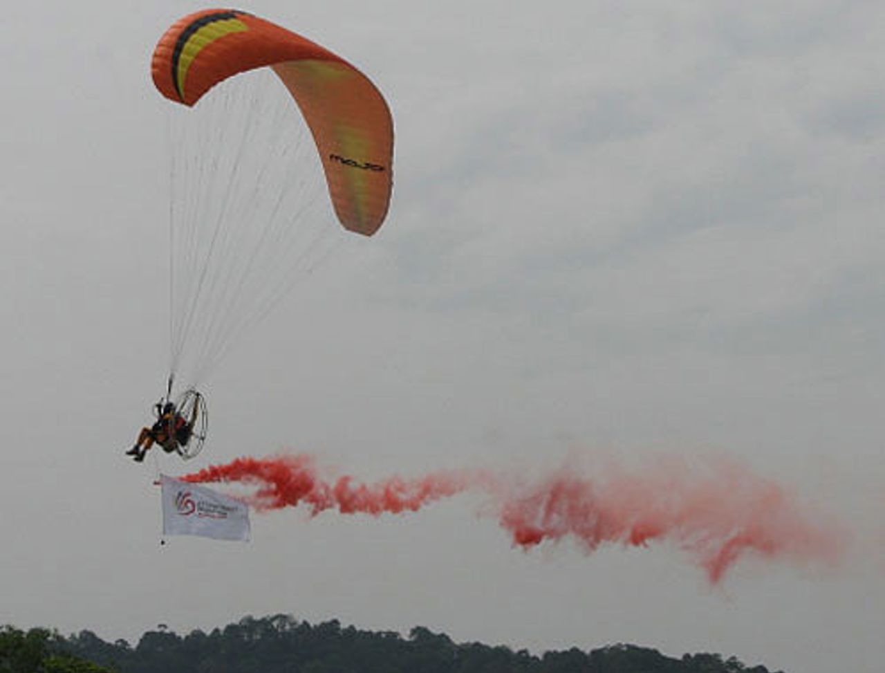 A para-glider swoops into the stadium carrying the ICC and Malaysian flags, Kuala Lumpur, February 15, 2008