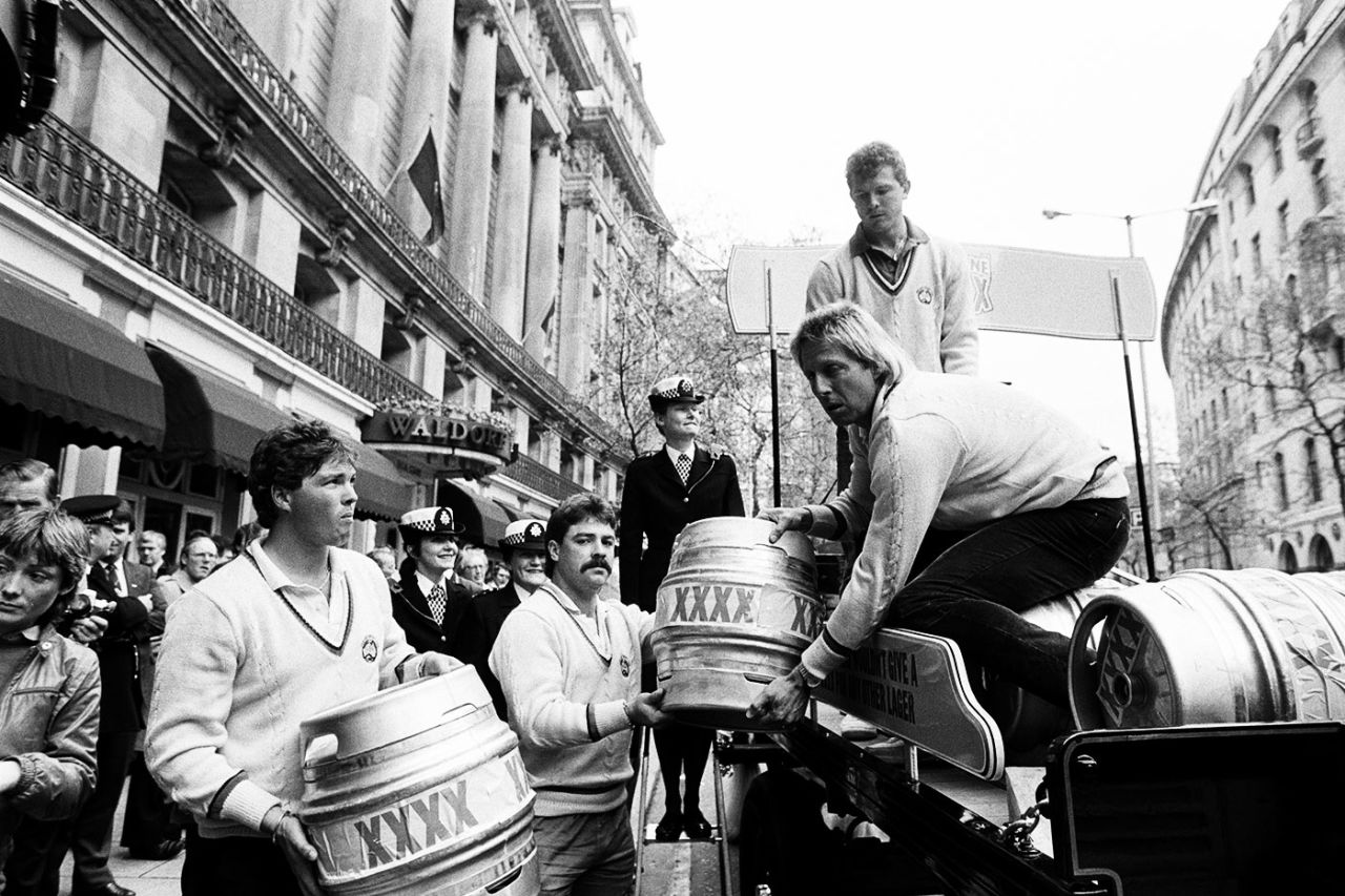 Greg Ritchie, David Boon, Jeff Thomson and Craig McDermott (back) help to load the first shipment of barrels of Australian lager Castlemaine XXXX onto a horse-drawn dray, London, May 15, 1985