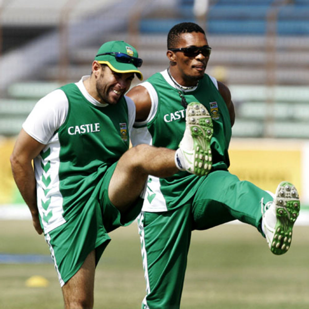 Neil McKenzie and Makhaya Ntini do a few warm-up exercises, Chittagong, February 28, 2008