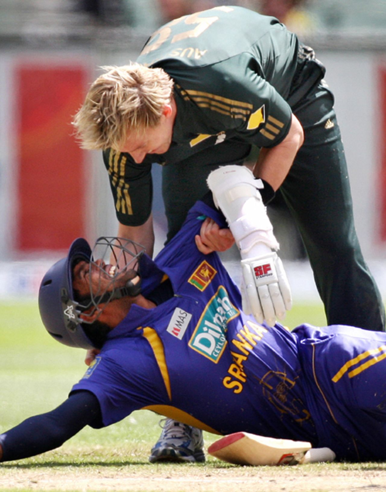 Brett Lee helps Dilruwan Perera to his feet after the latter had tripped over,
Australia v Sri Lanka, CB Series, 12th ODI, Melbourne, February 29, 2008