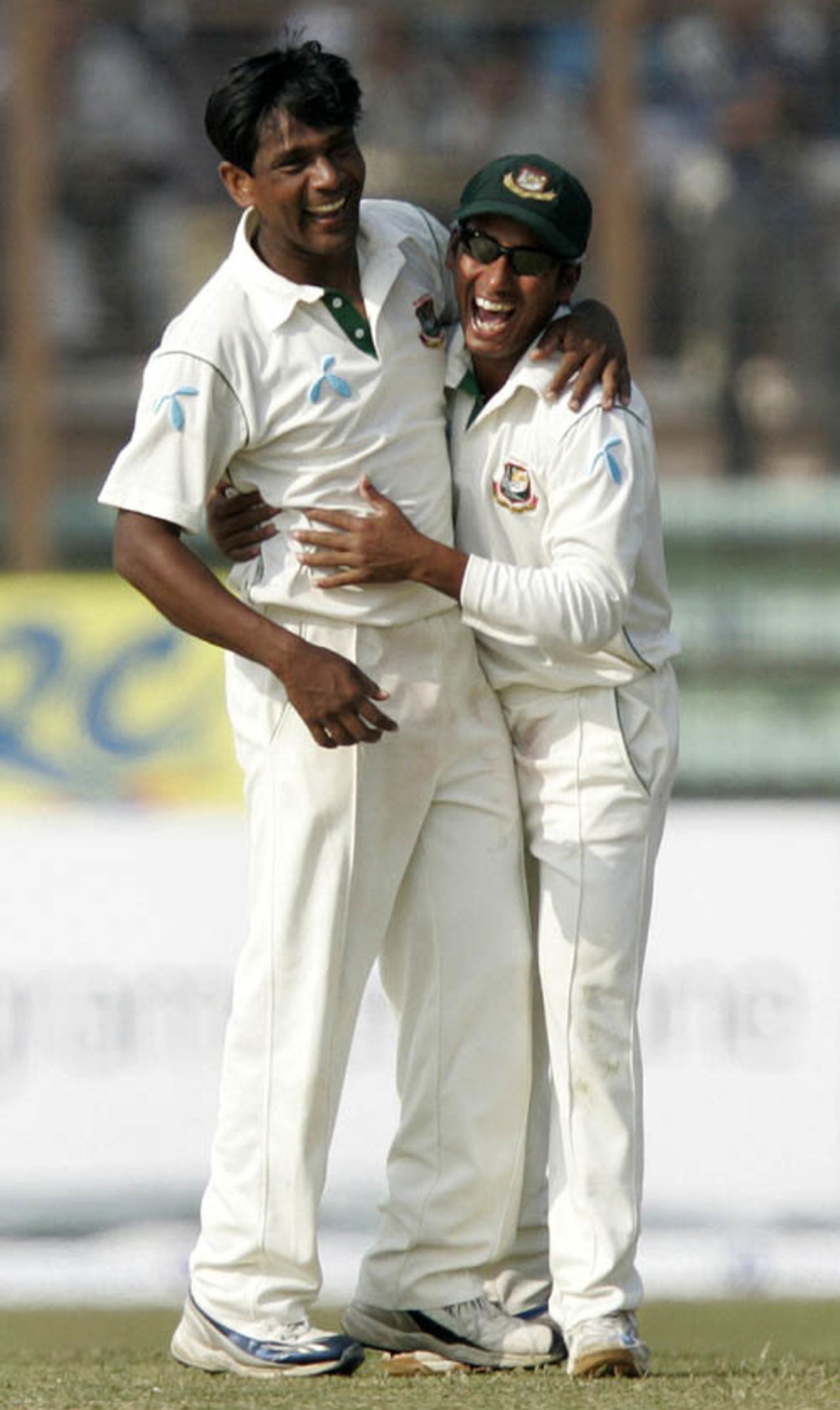 Mohammad Rafique is congratulated by Mohammad Ashraful on his 100th Test wicket, Bangladesh v South Africa, 2nd Test, Chittagong, 2nd day, March 1, 2008