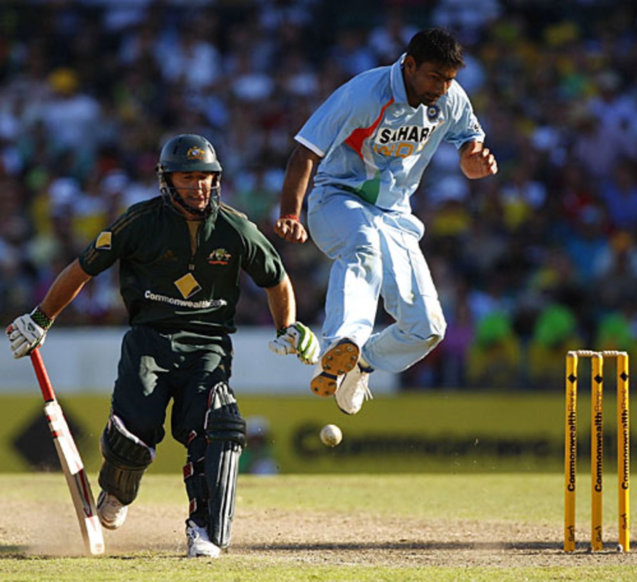 Praveen Kumar jumps out of the way of an attempt at hitting the stumps to run out Brad Hogg, Australia v India, CB Series, 1st final, Sydney, March 2, 2008