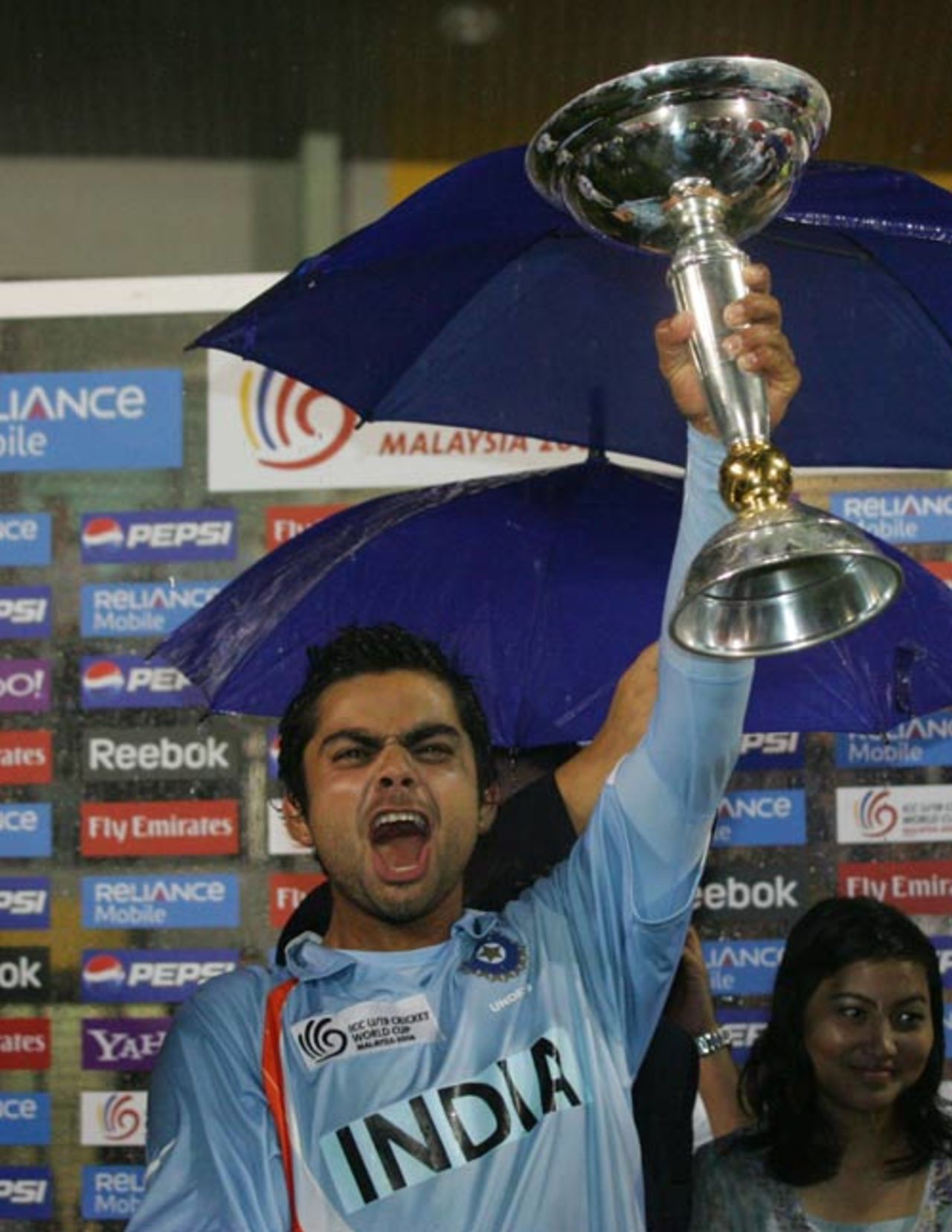 Virat Kohli, captain of the victorious Indian team, holds aloft the trophy, India v South Africa, Under-19 World Cup final, Kuala Lumpur, March 2, 2008 
