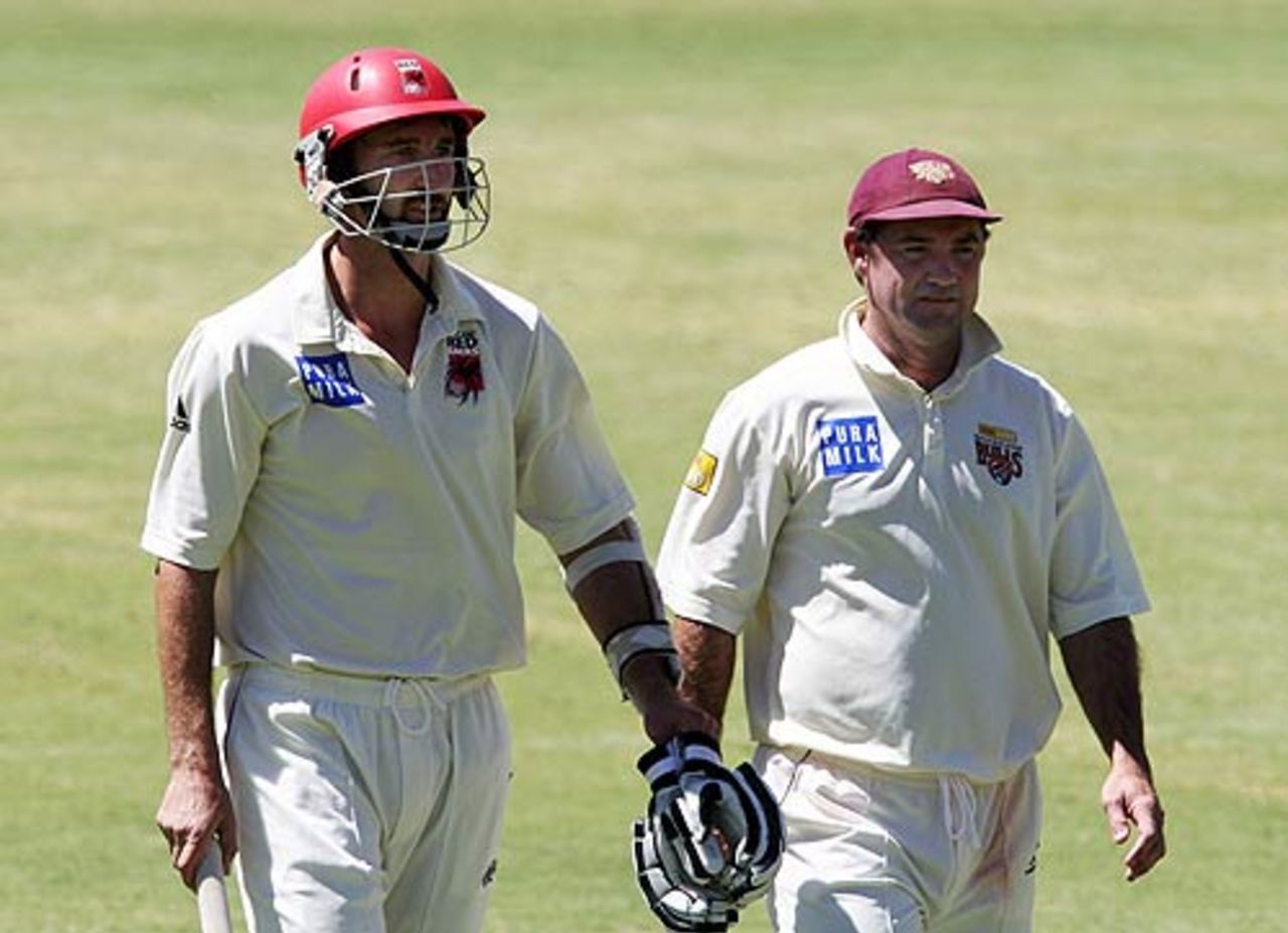 Jason Gillespie and Jimmy Maher leave the field for lunch during their last day of Pura Cup cricket, South Australia v Queensland, Pura Cup, Adelaide, March 3, 2008