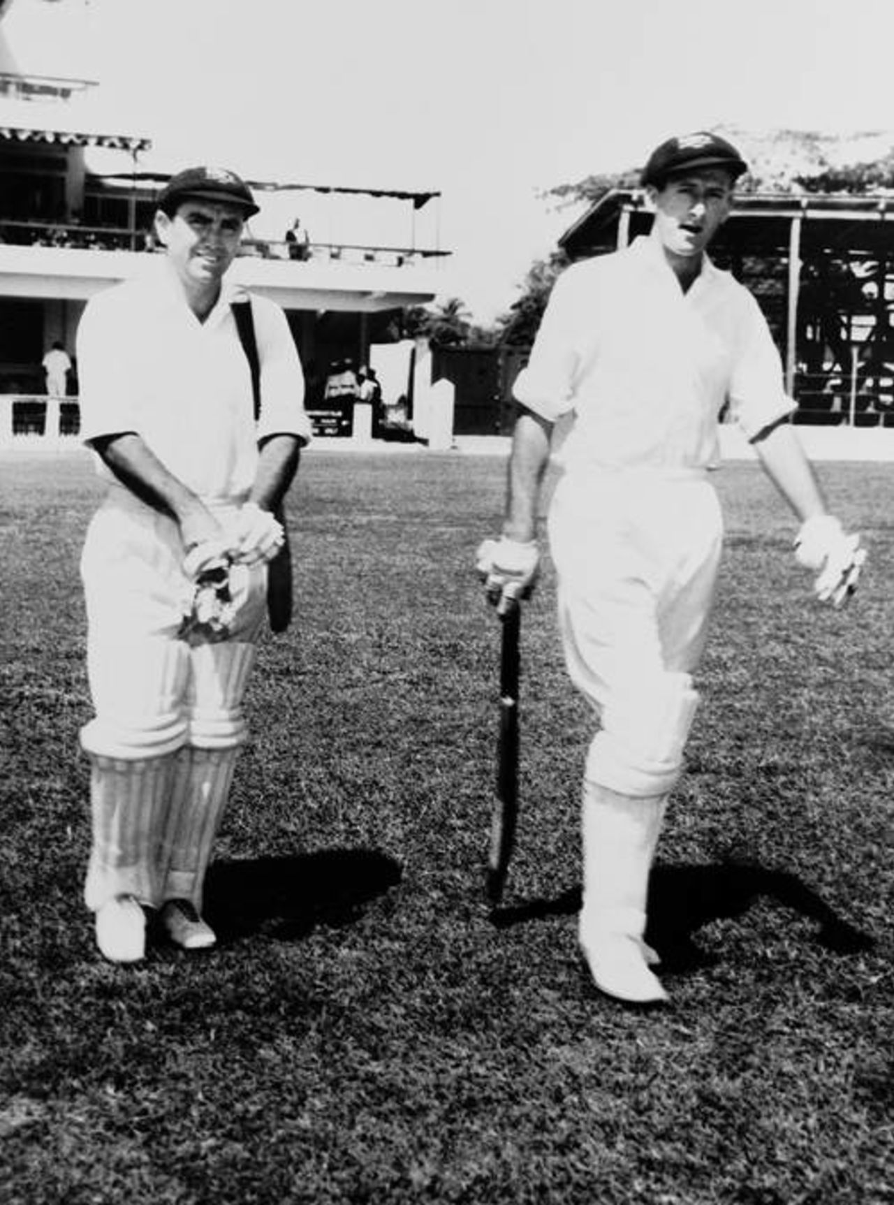 Australia's Bob Simpson (left) and Bill Lawry walk out to open the batting against West Indies in the first Test in Kingston, 1964-65