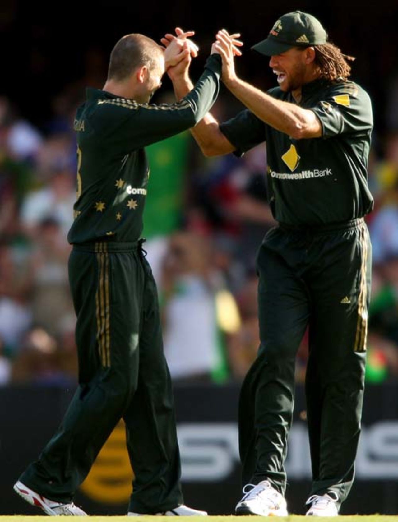 Michael Clarke and Andrew Symonds celebrate a strike, Australia v India, CB Series, 2nd final, Brisbane, March 4, 2008