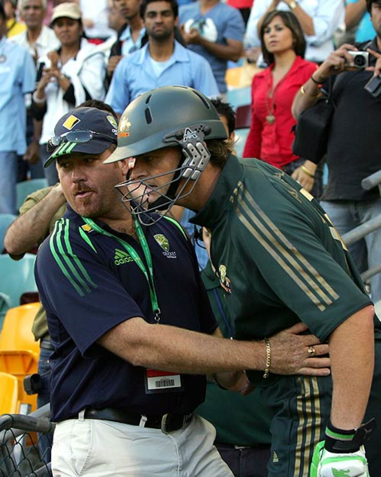 An official restrains Adam Gilchrist following an altercation with a cameraman, Australia v India, CB Series, 2nd final, Brisbane, March 4, 2008 