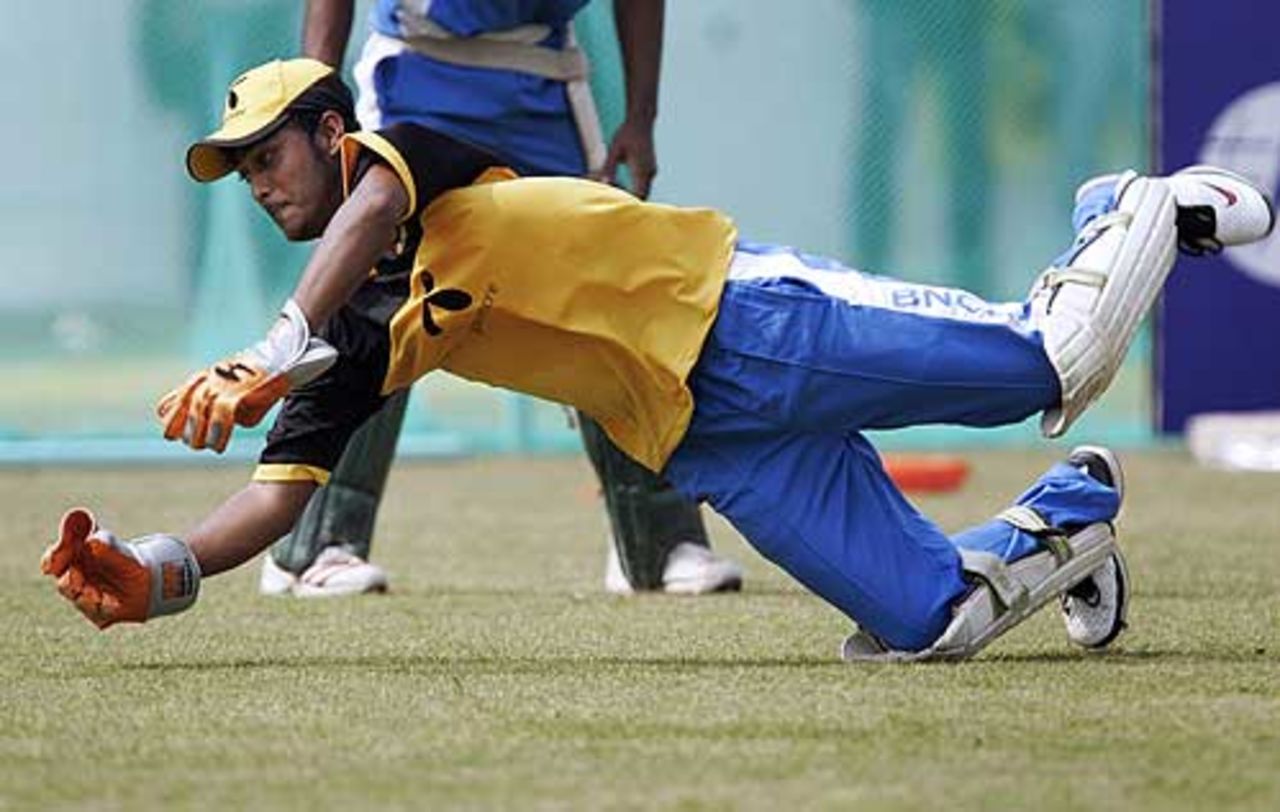 Dhiman Ghosh dives during practice at the Chittagong Divisional Stadium, Chittagong, March 6, 2008. 