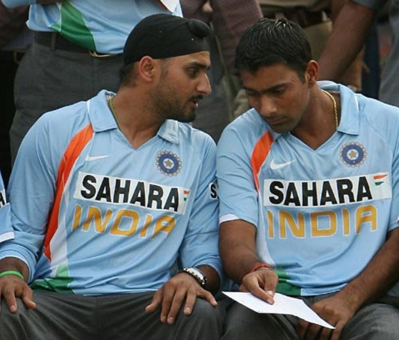 Harbhajan Singh and Praveen Kumar have a chat during the ceremony, New Delhi, March 6, 2008