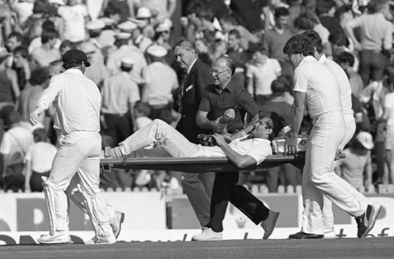 Bernard Thomas, the England physio, tends to Terry Alderman as he is stretchered off, Australia v England, 1st Test, Perth, November 12, 1982