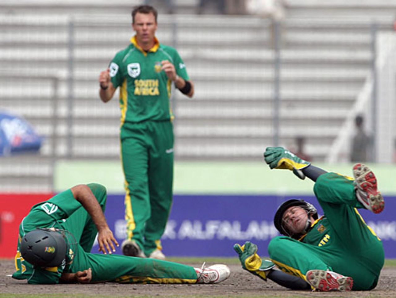AB de Villiers and Hashim Amla lie on the ground after attempting a catch, Bangladesh v South Africa, 3rd ODI, Mirpur, March 14, 2008 
