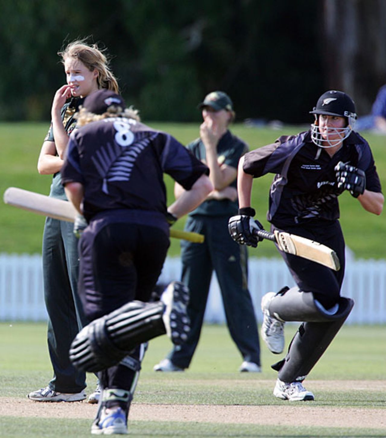 New Zealand batsmen take a run as Ellyse Perry looks on, New Zealand women v Australia women, 4th ODI, Rose Bowl, Lincoln, March 15, 2008