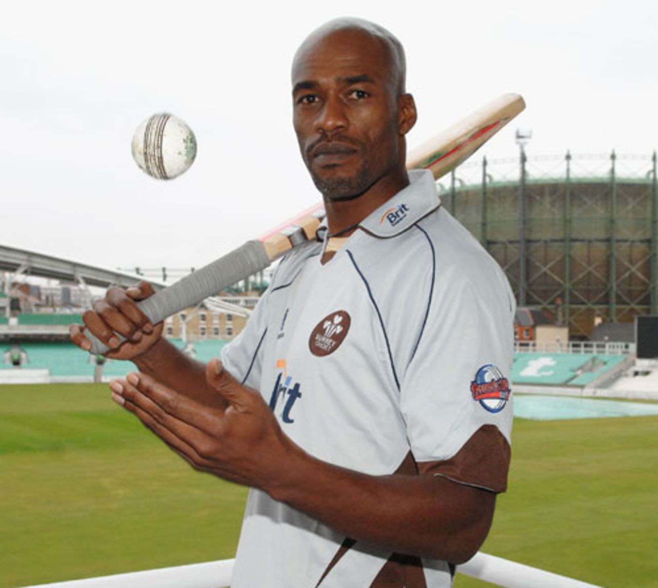 Chris Lewis poses after re-signing with Surrey, March 17, 2008