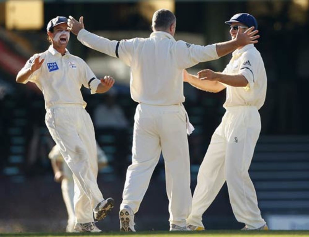 Stuart MacGill is congratulated after claiming a wicket with his first ball, New South Wales v Victoria, Pura Cup final, 4th day, Sydney, March 18, 2008