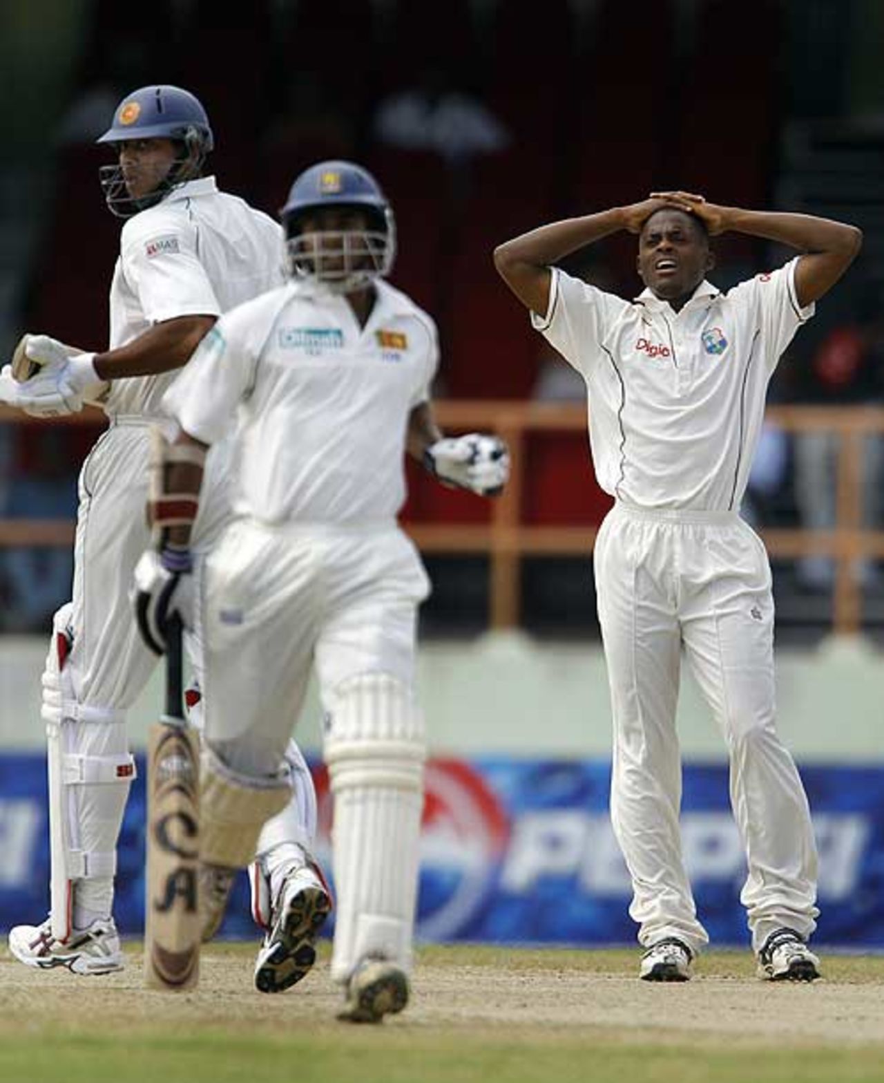 Daren Powell looks on as Sri Lanka's openers go strong, West Indies v Sri Lanka, 1st Test, Guyana, 1st day, March 22, 2008