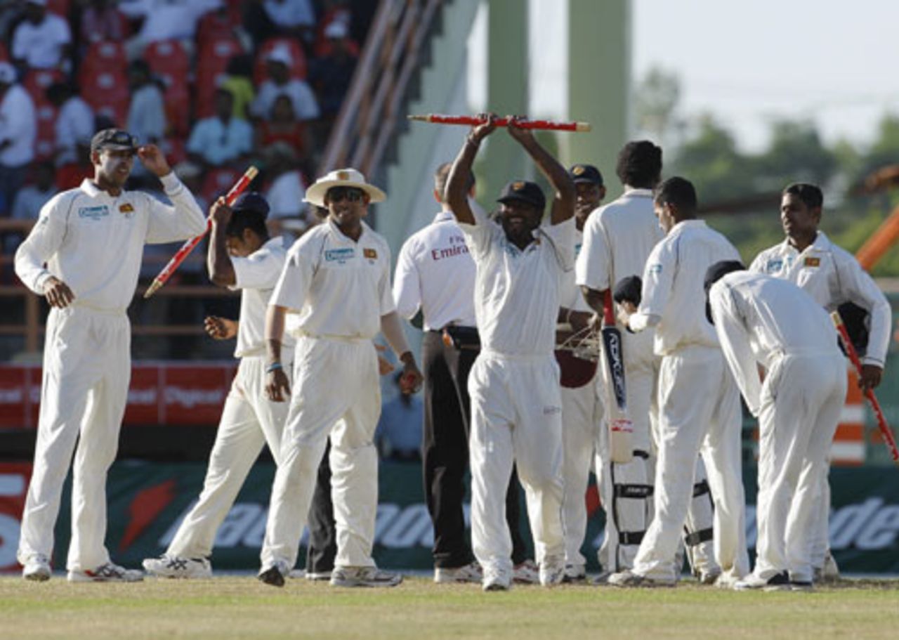 Muttiah Muralitharan holds aloft a stump after the historic victory, West Indies v Sri Lanka, 1st Test, Guyana, 5th day, March 26, 2008