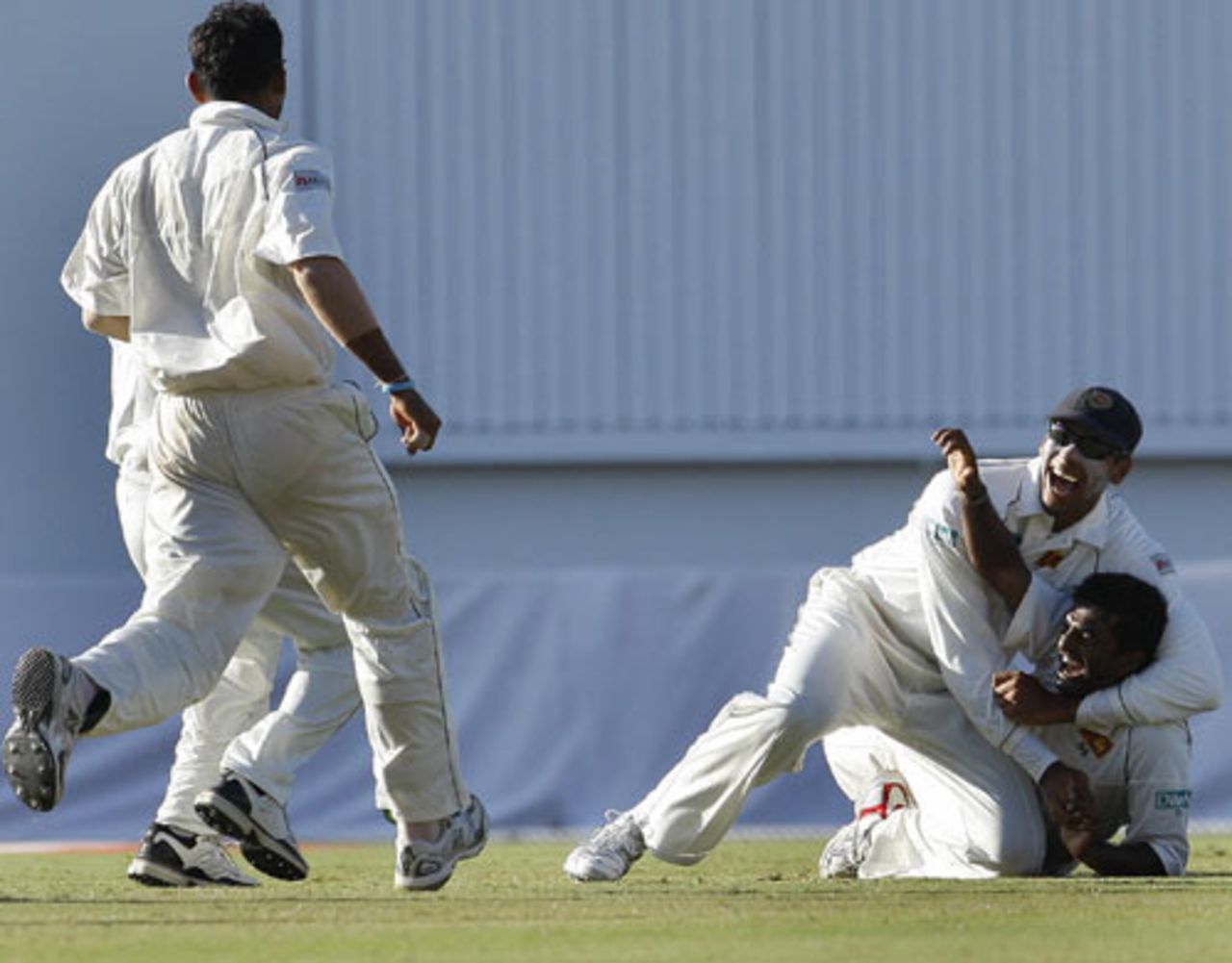 Muttiah Muralitharan is about to be mobbed after completing a stunning catch, West Indies v Sri Lanka, 1st Test, Guyana, 5th day, March 26, 2008