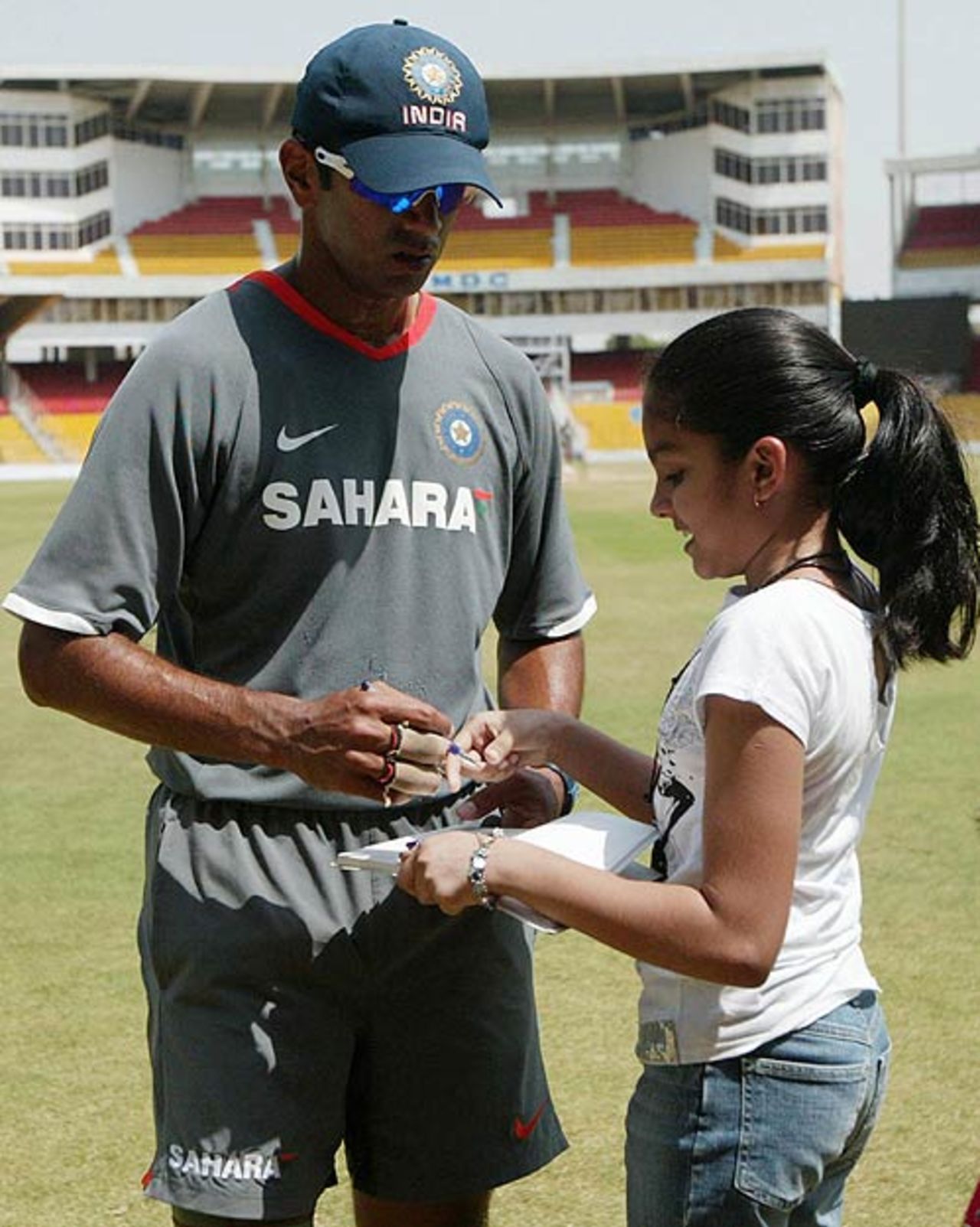 Rahul Dravid acknowledges a young fan with autographs after the practice session, April 7, 2008