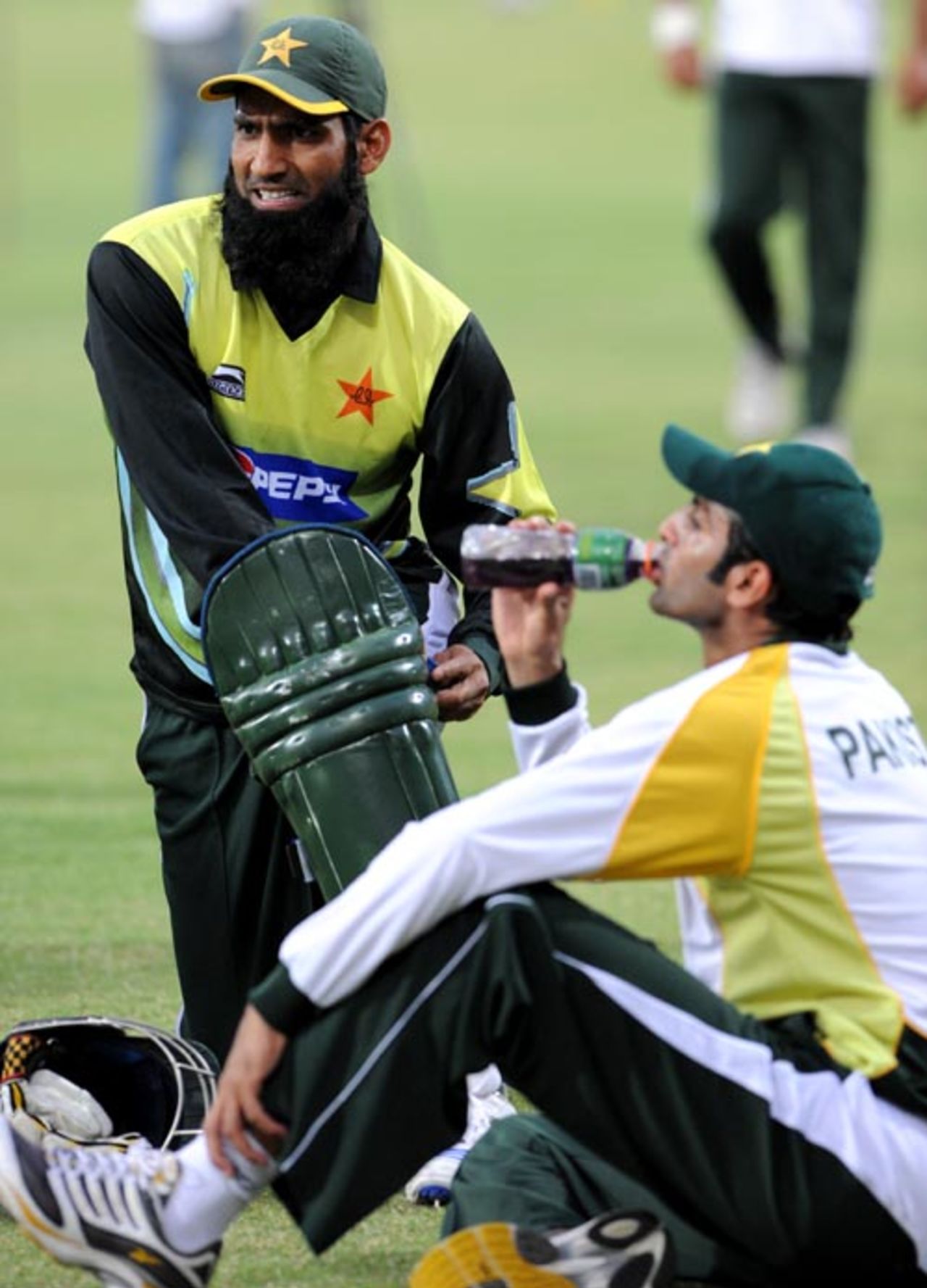 Mohammad Yousuf pads up while Shoaib Malik takes a break, Faisalabad, April 10, 2008