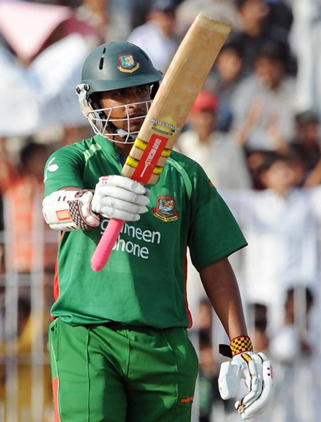 Tamim Iqbal acknowledges the cheers for his half-century, Pakistan v Bangladesh, 2nd ODI, Faisalabad, April 11, 2008 