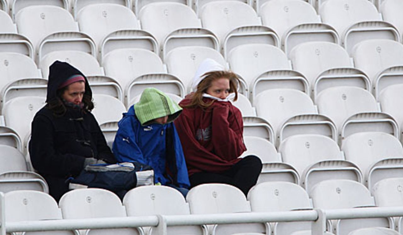 Welcome to summer: three hardy spectators defy the elements at Lord's on the second day of the season, 2nd day, Lord's, April 11, 2008