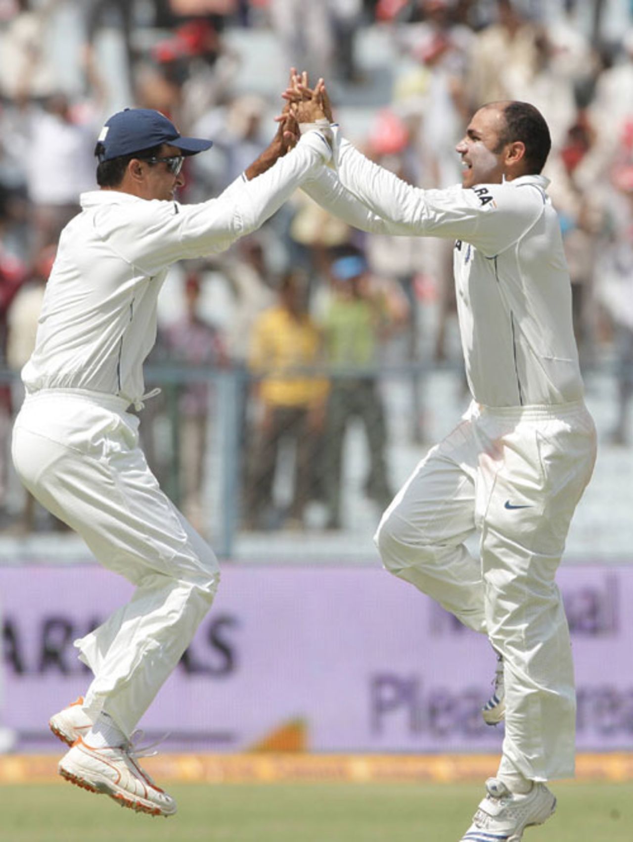 Sourav Ganguly and Virender Sehwag exchange high-fives after a strike, India v South Africa, 3rd Test, Kanpur, 3rd day, April 13, 2008