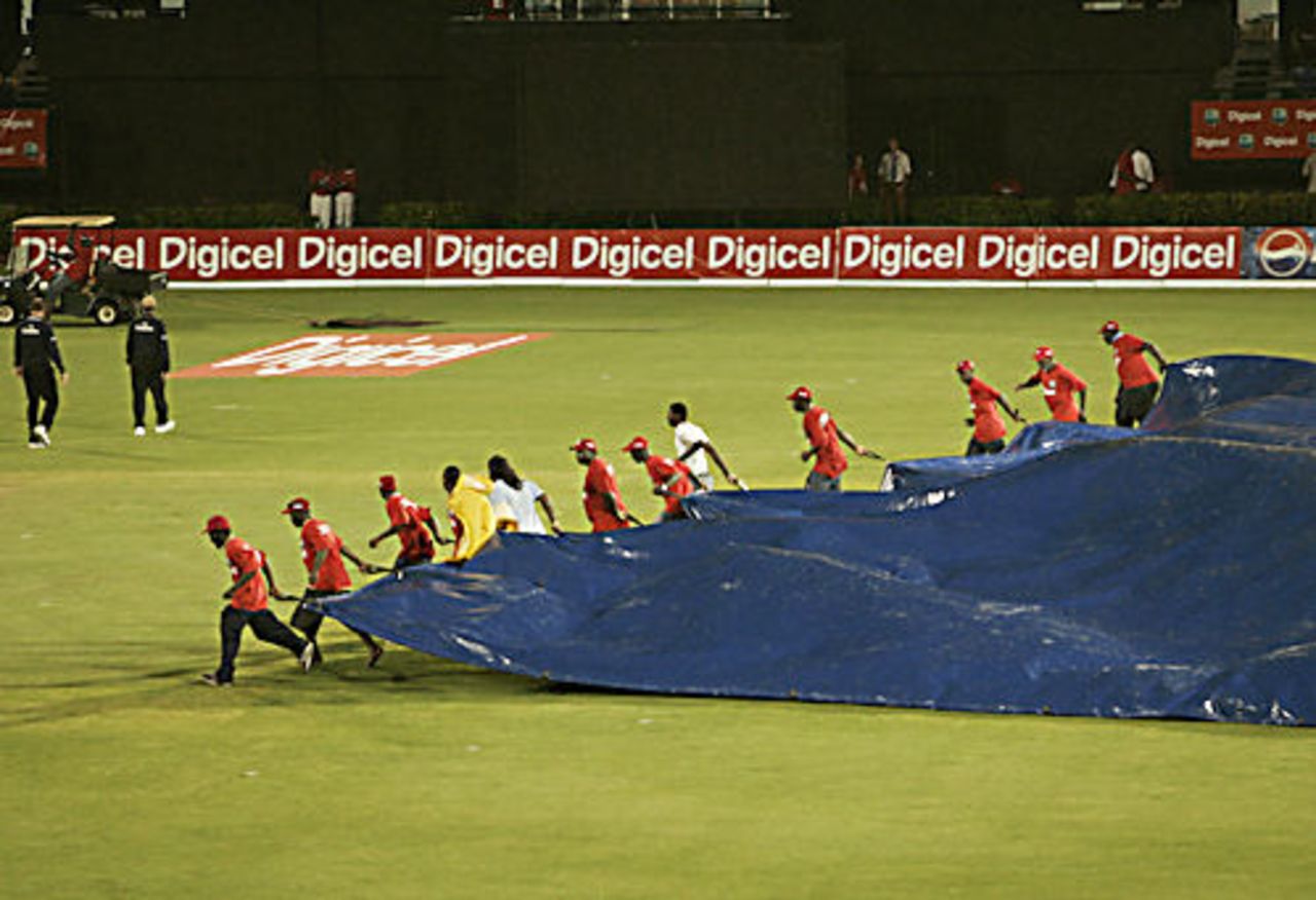 Ground staff put the covers on after heavy rain interrupts play, West Indies v Sri Lanka, 3rd ODI, St Lucia, April 15, 2008