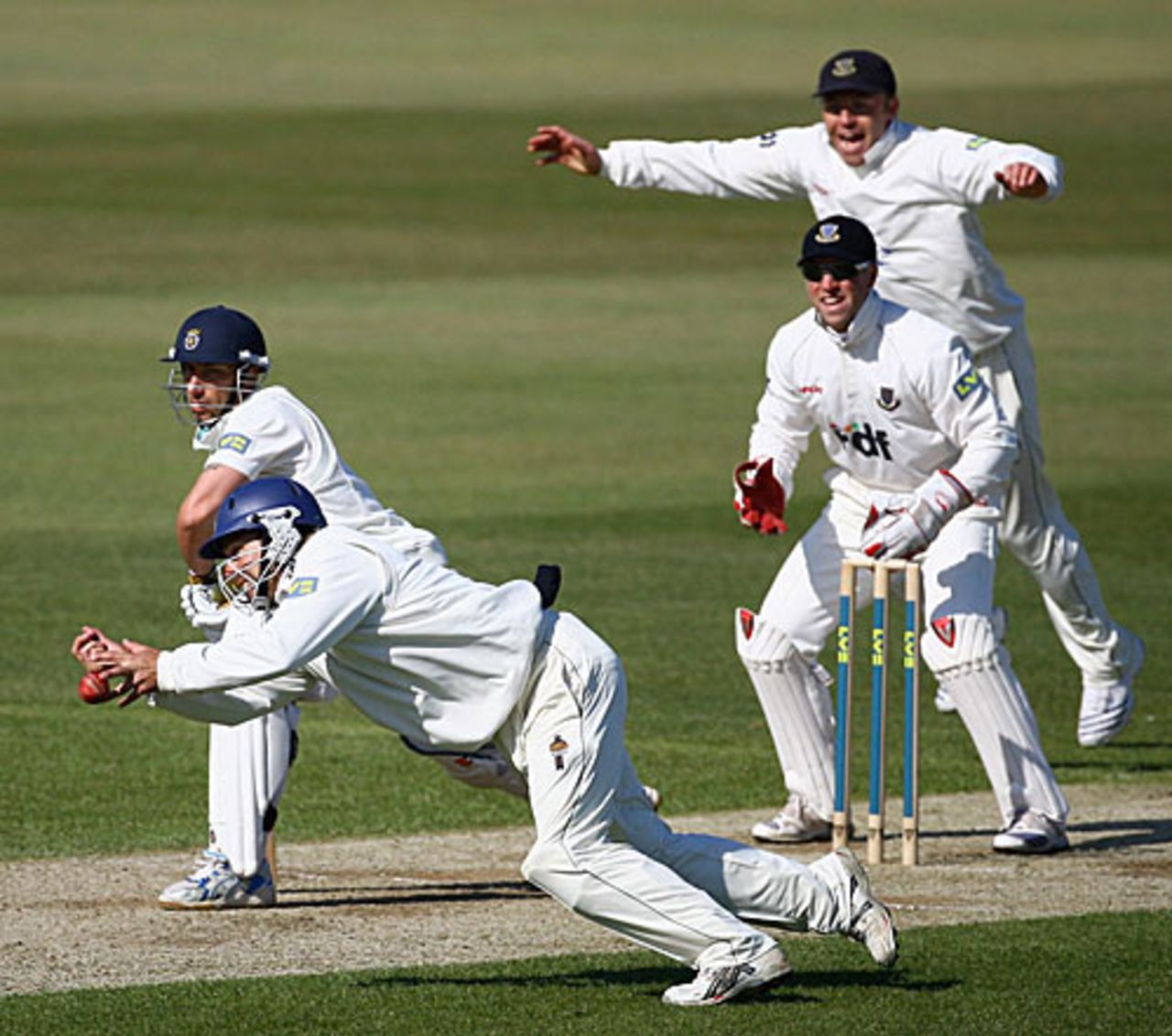 Nic Pothas lunges forward but a diving Murray Goodwin at short leg can't hold on, Hampshire v Sussex, Southampton, April 17, 2008