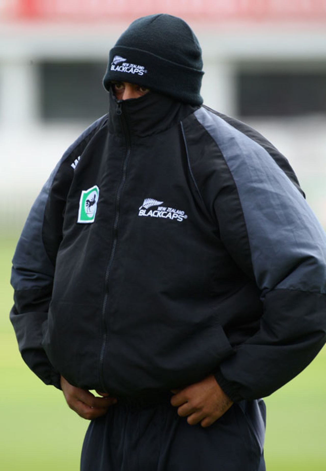 Jeetan Patel shelters from the cold and wet, Kent v New Zealanders, Canterbury, April 29, 2008