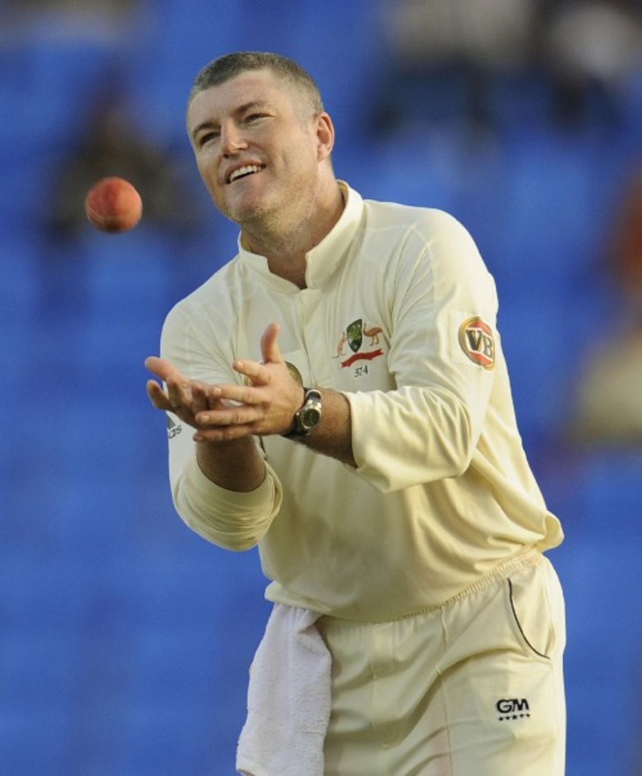 Stuart MacGill takes the ball from a team-mate, West Indies v Australia, 2nd Test, Antigua, June 1, 2008