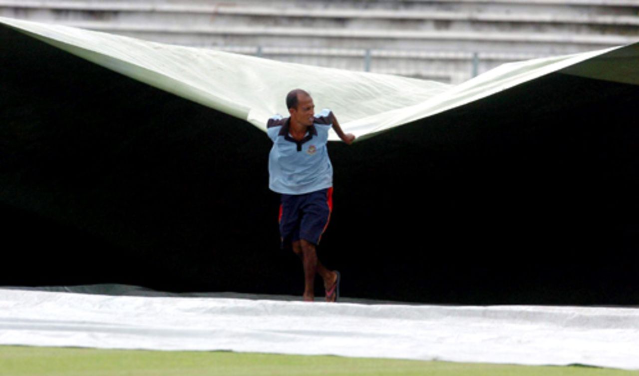 The covers come on at the Shere Bangla National Stadium, Bangladesh v Pakistan, 1st match, Kitply Cup, Mirpur, June 8, 2008