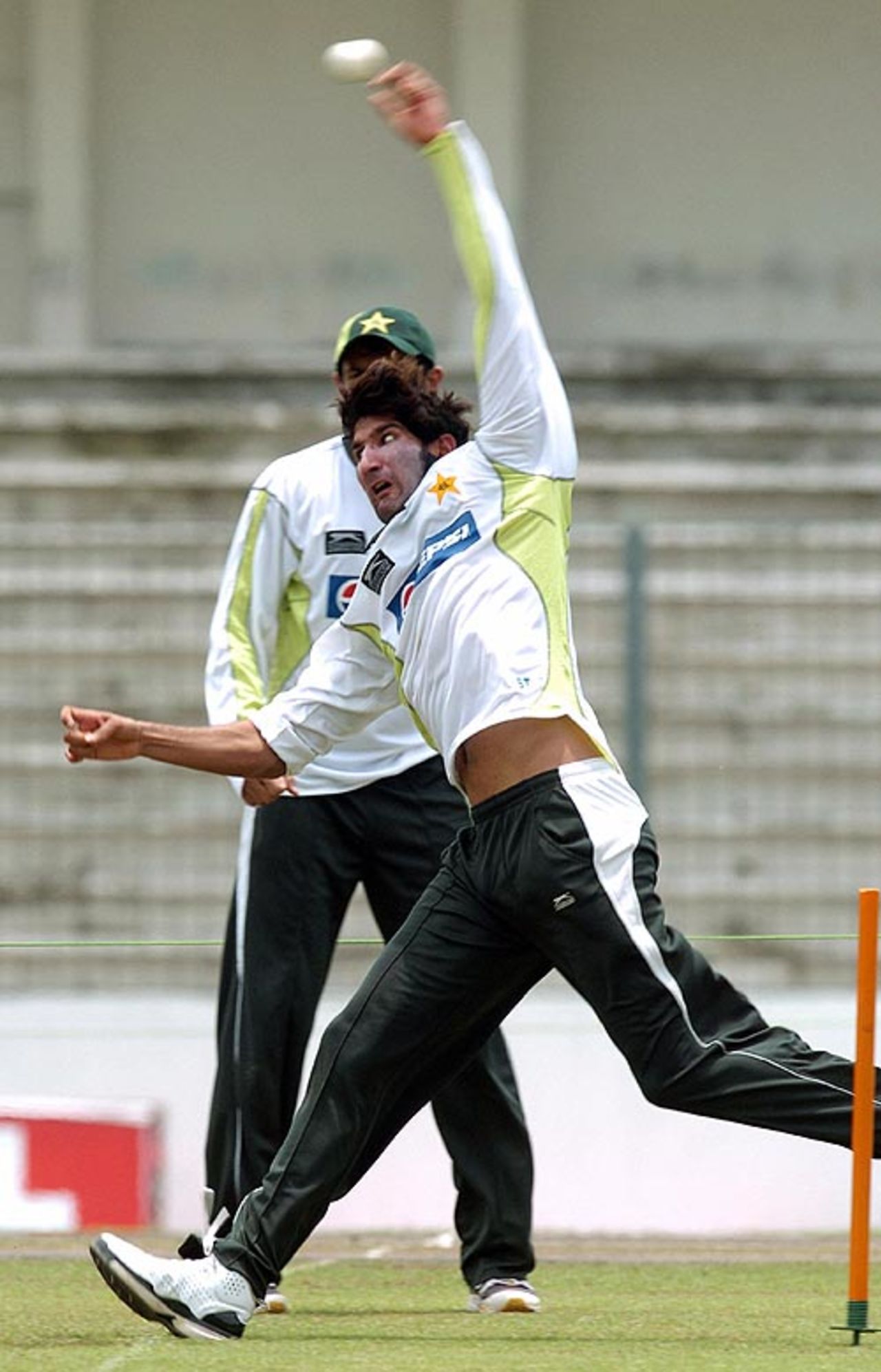 Stay within limits: Sohail Tanvir keeps his front foot behind the line as a team-mate looks on, Mirpur, June 13, 2008