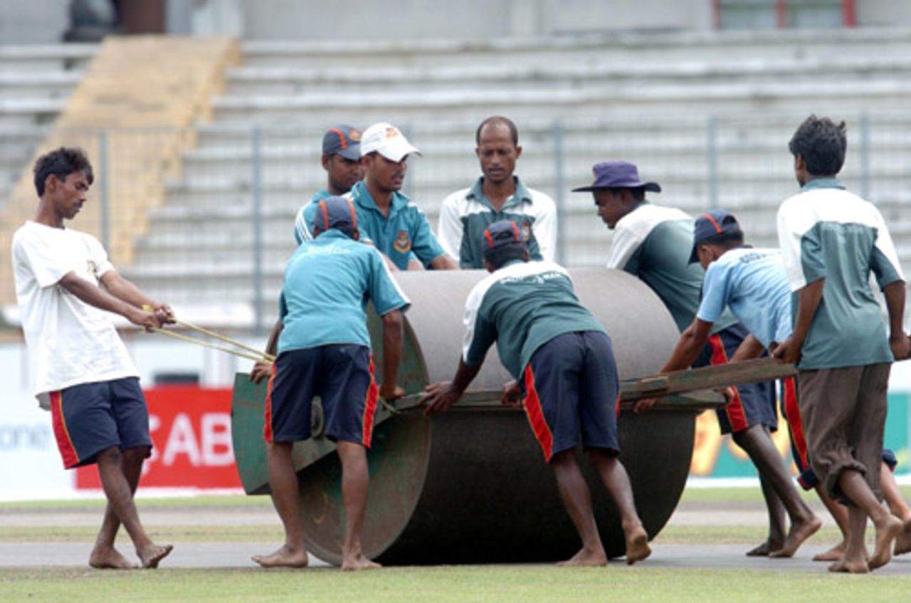 The groundsmen at the Shere Bangla National Stadium get the track ready for the final, Mirpur, June 13, 2008