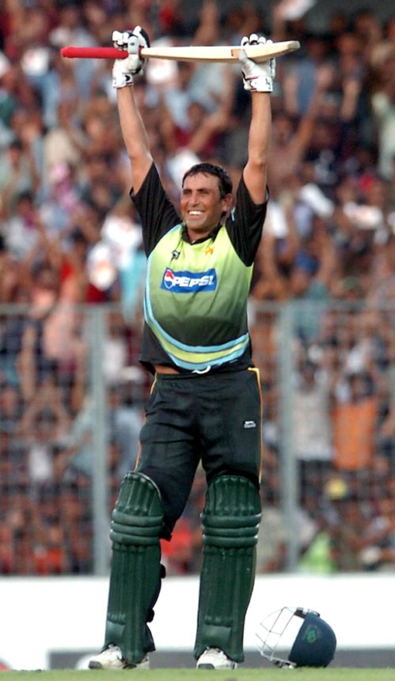 Younis Khan soaks in the moment after scoring his hundred, India v Pakistan, Kitply Cup final, Mirpur, June 14, 2008