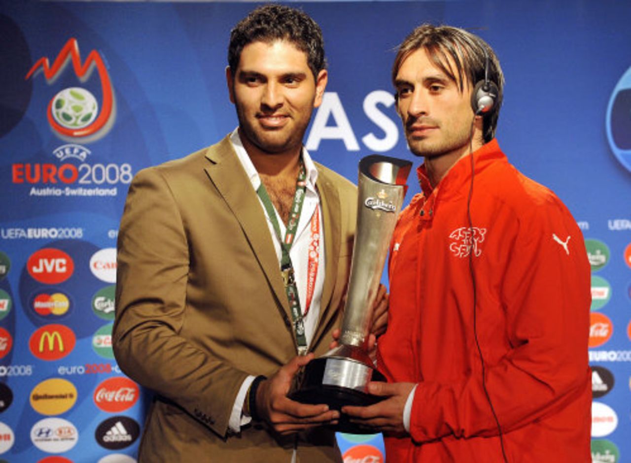 Yuvraj Singh hands over the Man-of-the-Match award to Switzerland's Hakan Yakin, Basel, June 15, 2008 