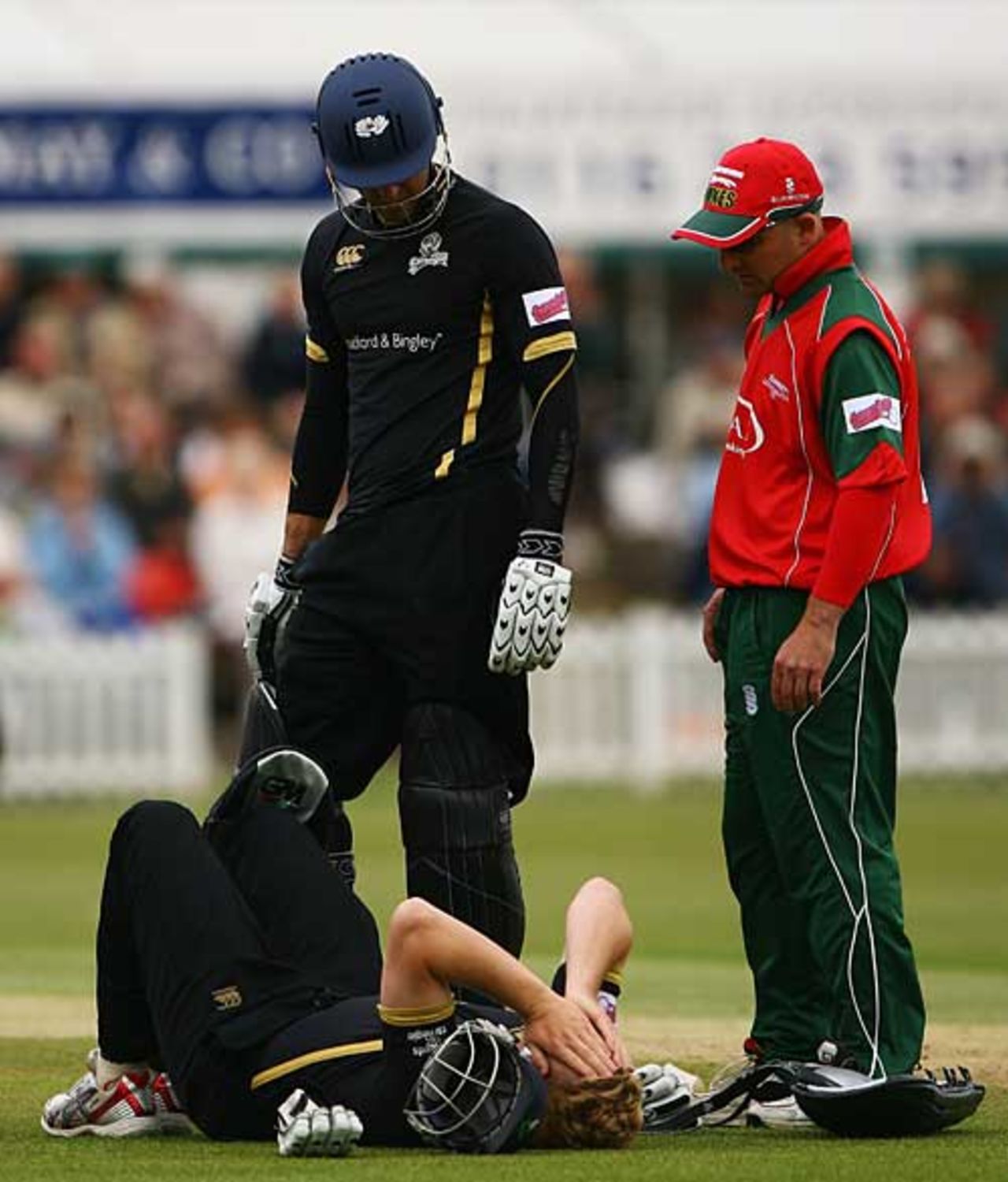 An injured Andrew Gale lies on the ground in pain as Michael Vaughan and Jeremy Snape show concern, Leicestershire v Yorkshire, Twenty20, Grace Road, June 17, 2008
