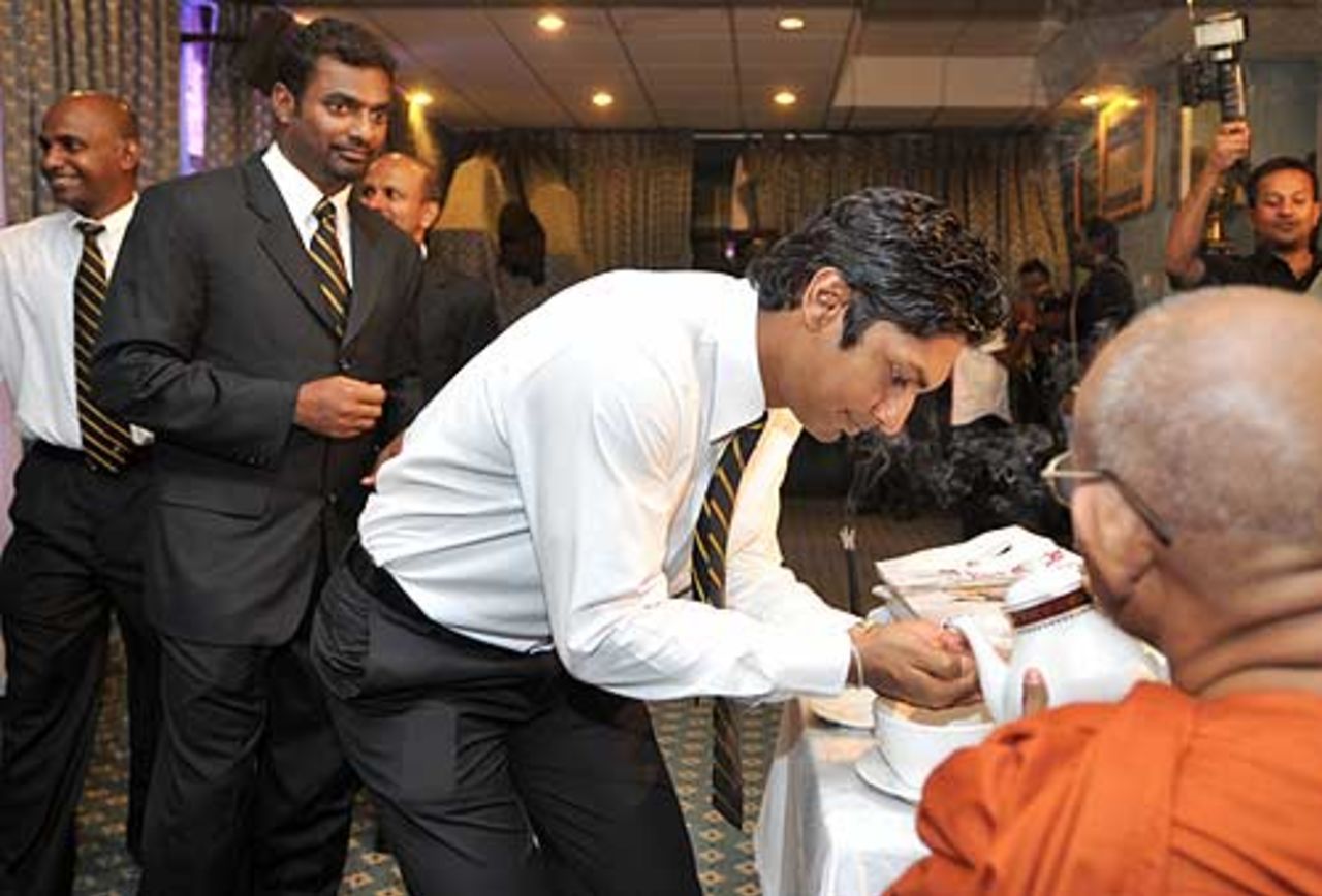 Sri Lankan cricketers take part in a ritual Buddhist ceremony, Colombo, June 22, 2008