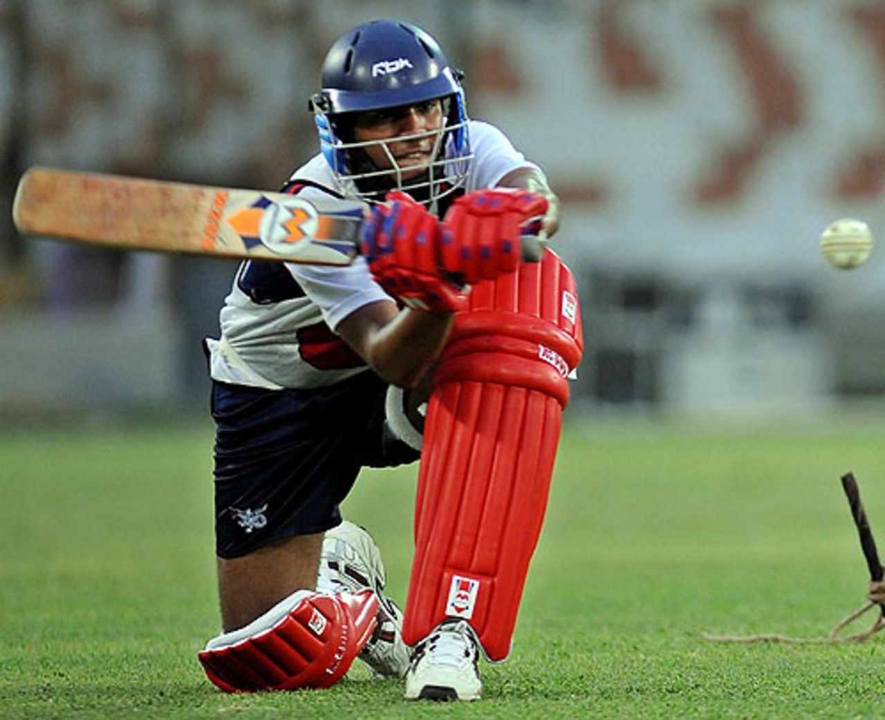 Zain Abbas plays the sweep during Hong Kong's training session, Karachi, June 22, 2008